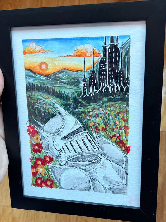 Framed artwork with a cityscape and landscape design.